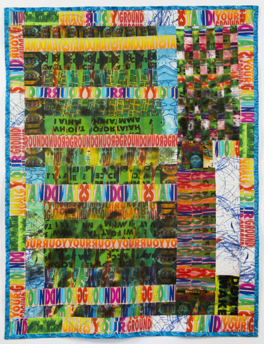 A brightly colored quilted collage repeats the words STAND YOUR GROUND