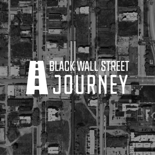 The words Black Wall Street Journey overlaid on a satellite map of a city block