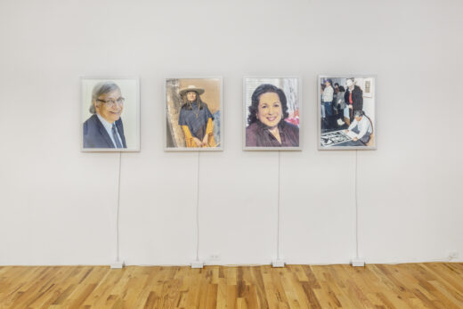 Four portraits of civic leaders in light boxes