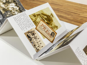 an accordion style book with photographs and hand written text