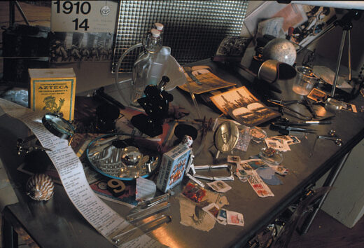 A metal table cluttered with scientific instruments